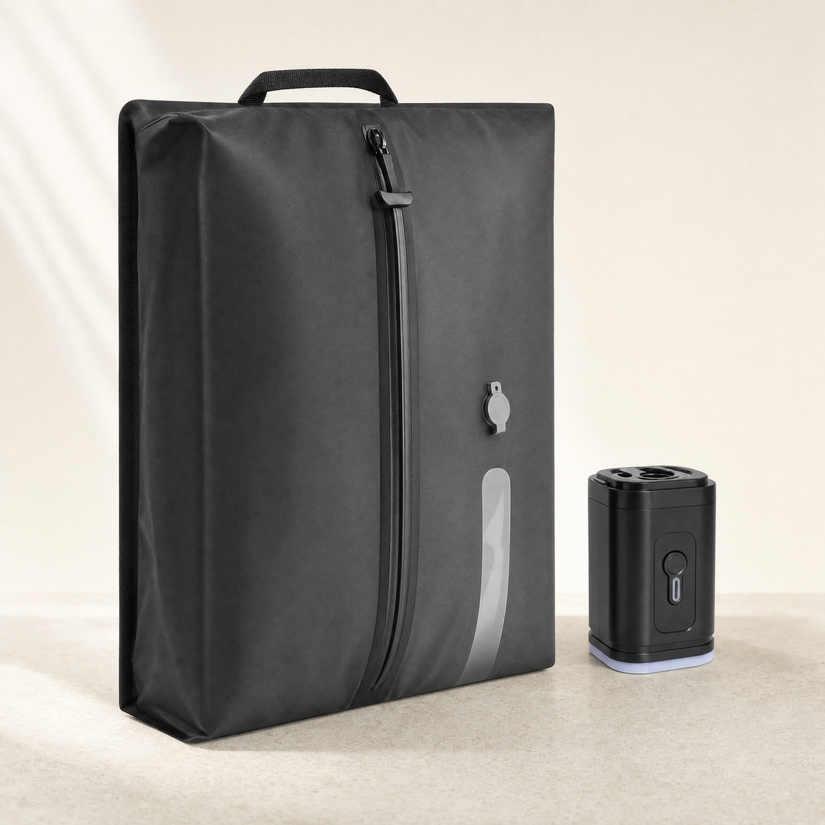 HollowPack compression travel bag in black with its electric pump